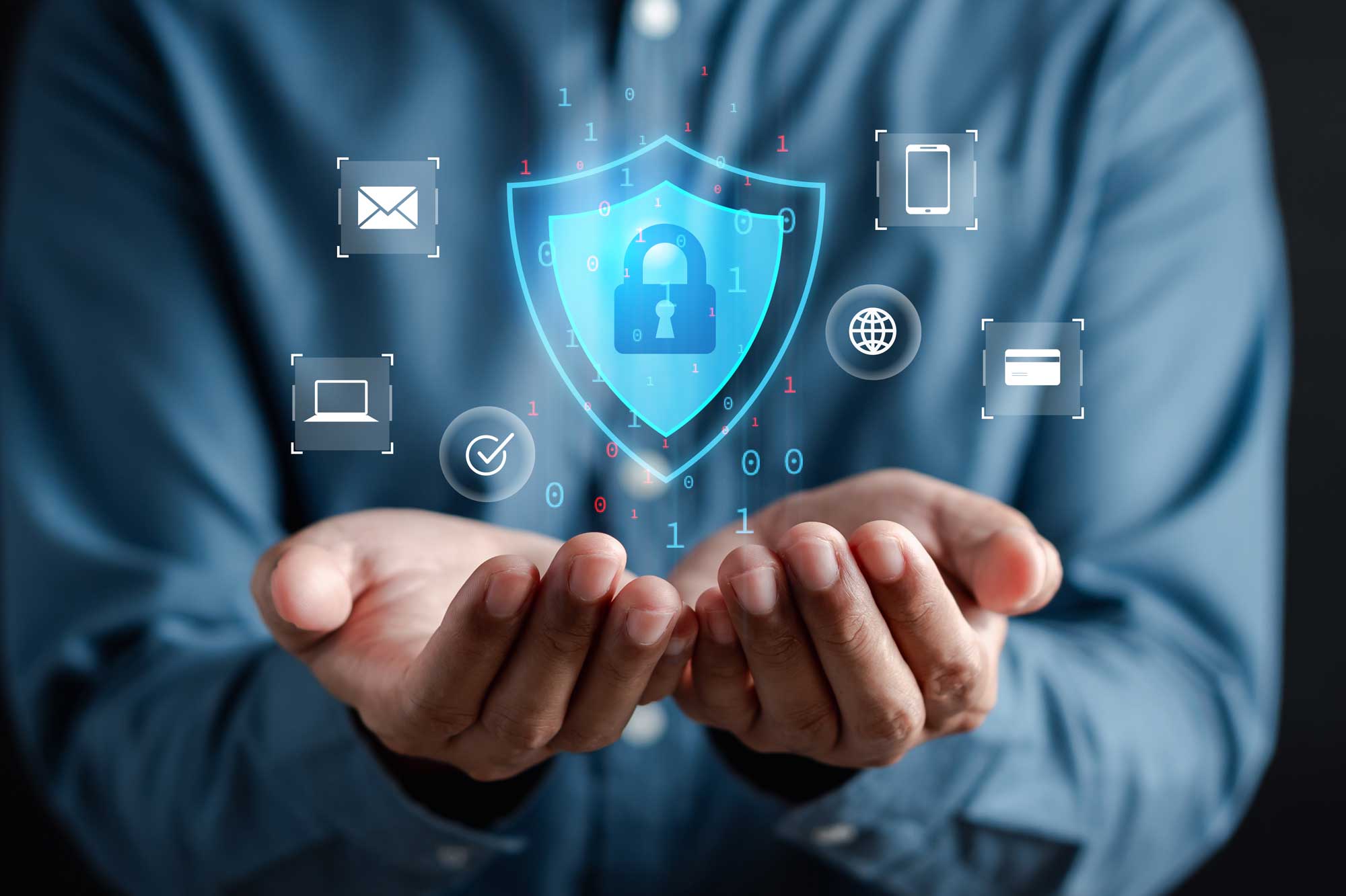 Hands holding security-themed icons