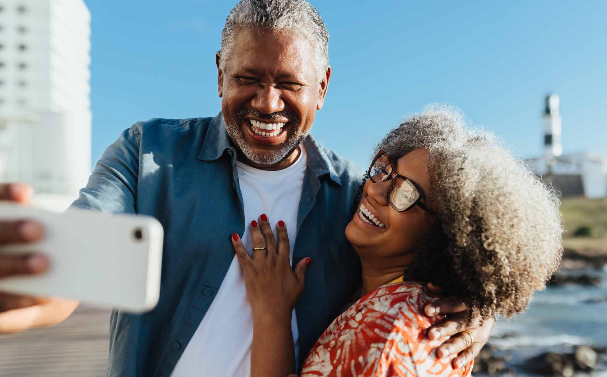 Couple taking a selfie near the water